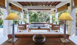 Living area of the Pita Linggar 3 bedroom home with modern furniture and open aspect outlook over the Bali jungle