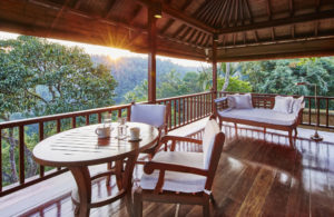 Terrace of the Master bedroom of the Sukma Taru home at the Como Shambhala estate featuring comfortable furniture and dining table